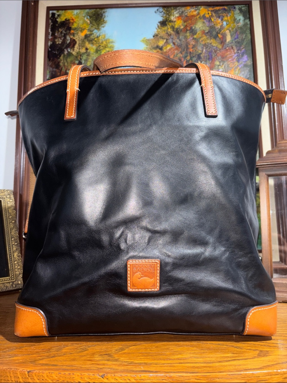 Dooney & Bourke Black Leather Tote with Tan Trim and Handles
